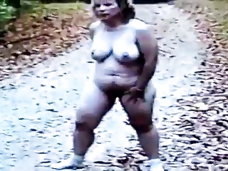 Nude mature woman being natural